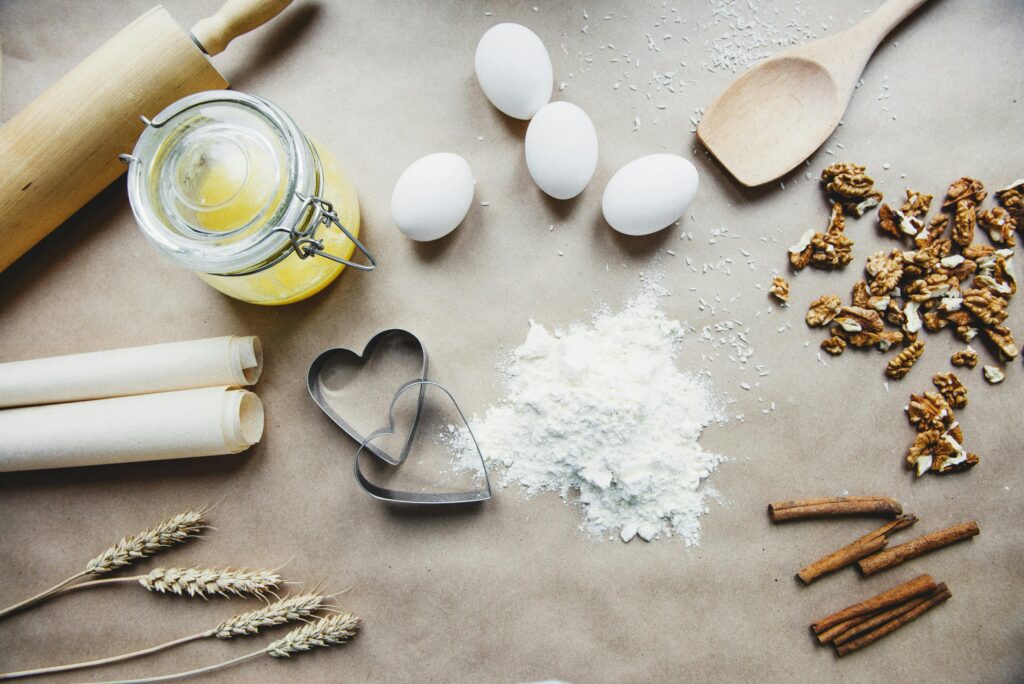 A collection of baking essentials including flour, eggs, and nuts, perfect for homemade recipes.